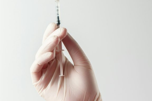 Fat Dissolve Injections Hand holding syringe